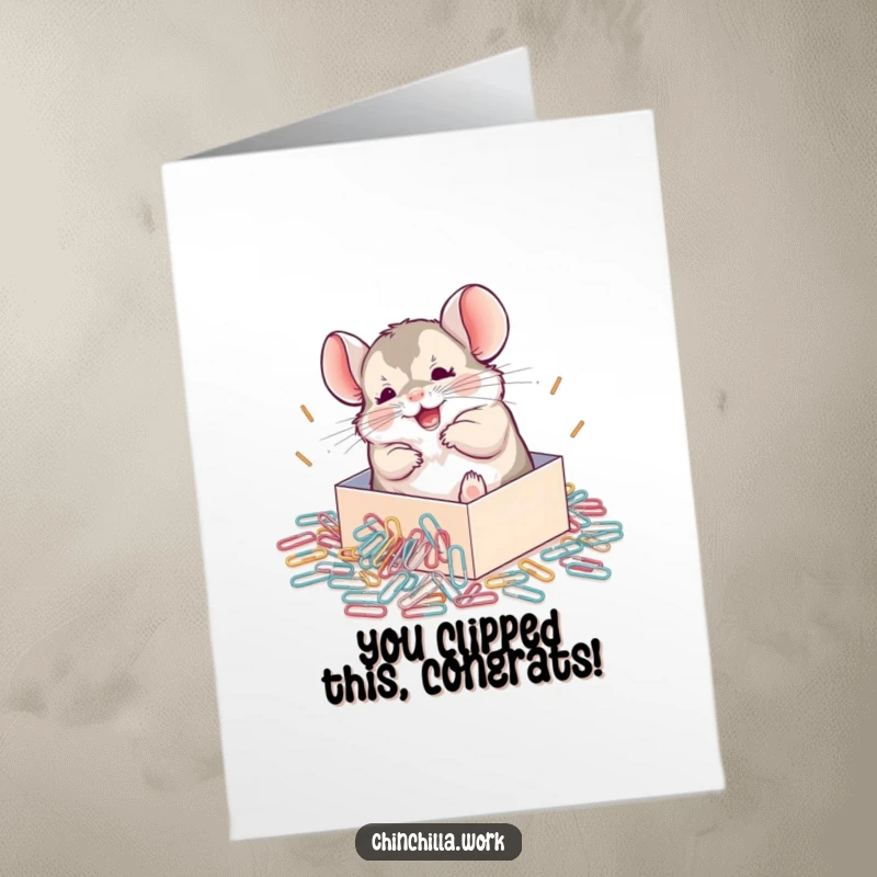 Funny Free Printable congratulations card depicting a chinchilla joyfully playing in a pile of spilled paperclips, celebrating achievements.